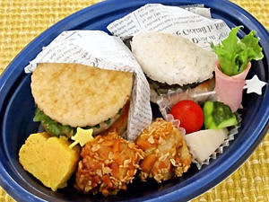 15日に数量限定で販売される「たべたら元気まん点！ごはんでバーガー弁当」