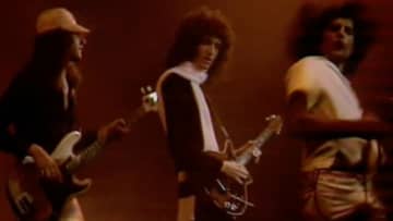 Queen_ John Deacon, Brian May, Freddie Mercury. Hammersmith Odeon, December 24, 1975. © Queen Productions